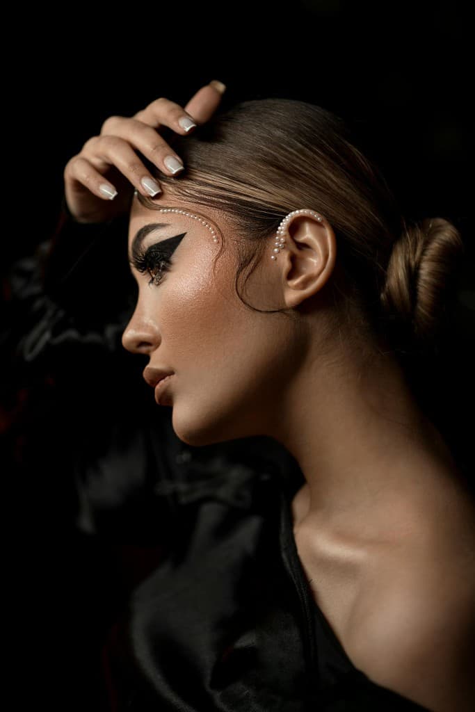 Model wearing French tip gel nail wraps